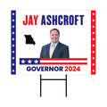 a political yard sign with a picture of a man in a suit
