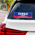 a blue and red decal on the back of a white car
