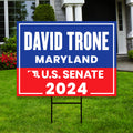 a political yard sign in front of a house
