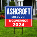 a yard sign with a house in the background