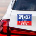 a bumper sticker on the back of a car