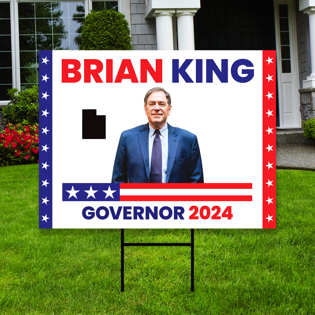 a political sign with a picture of a man in a suit
