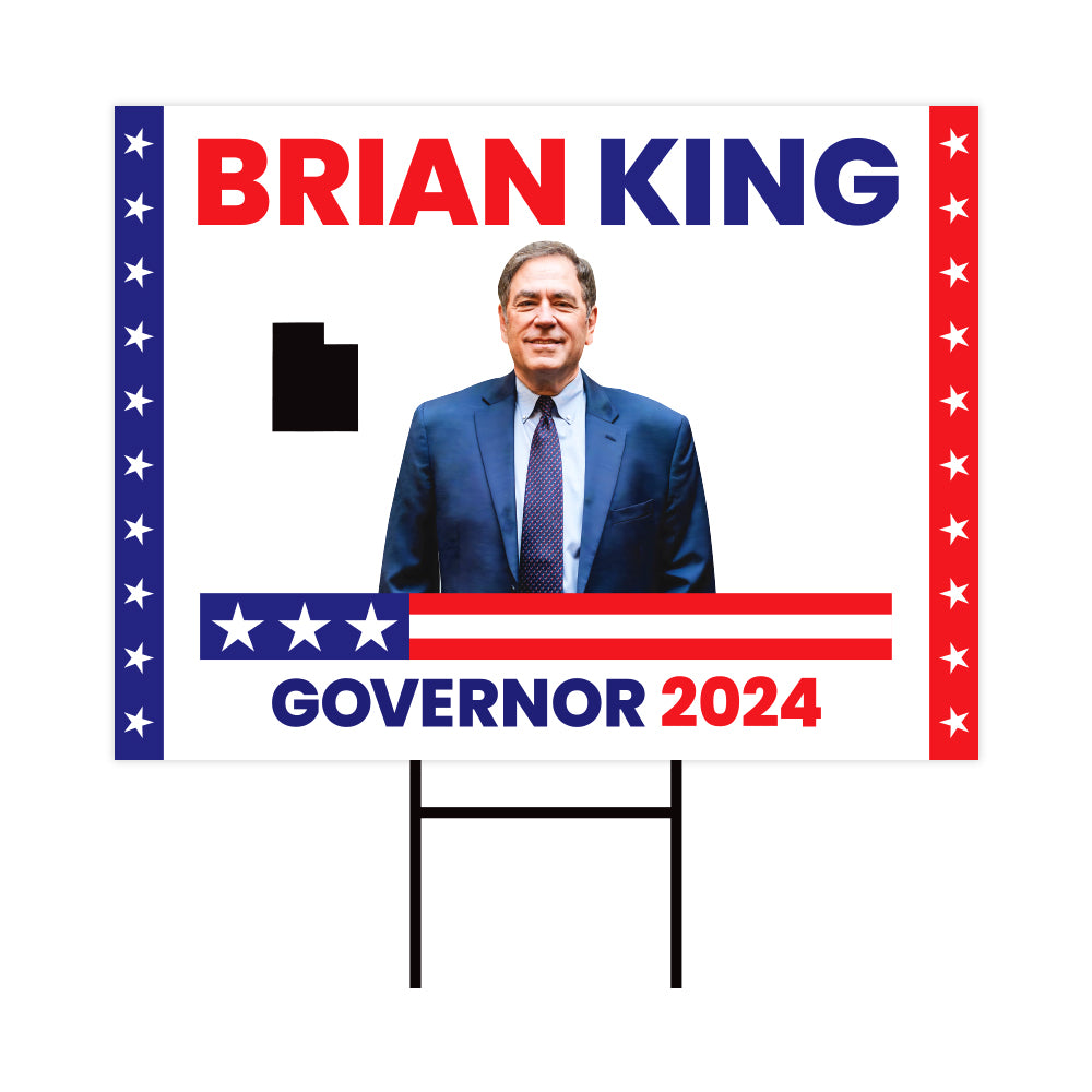 a political sign with a picture of a man in a suit