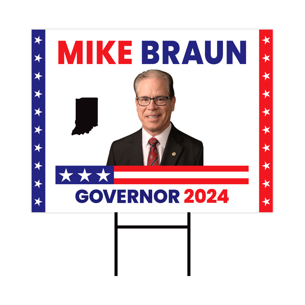 a political sign with a picture of a man in a suit and tie