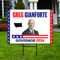 a political yard sign in front of a house