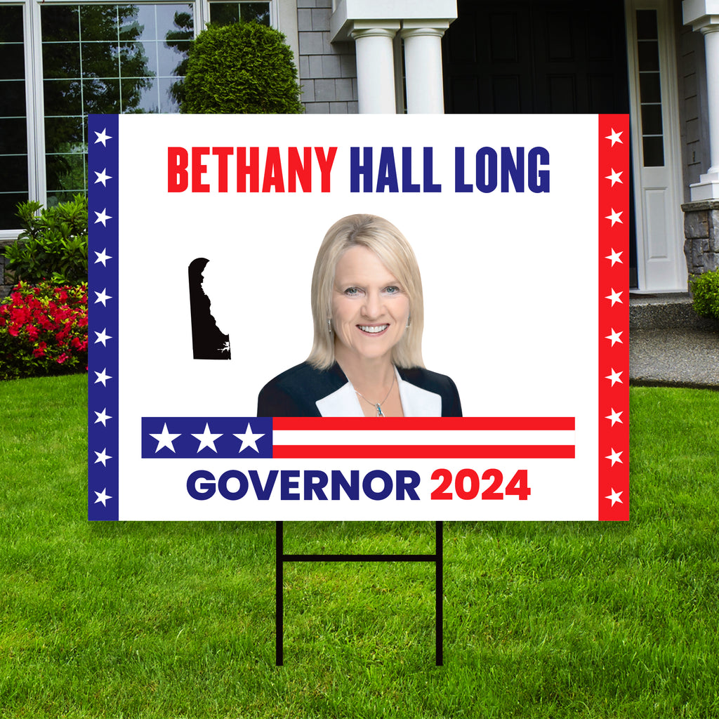 a political yard sign in front of a house