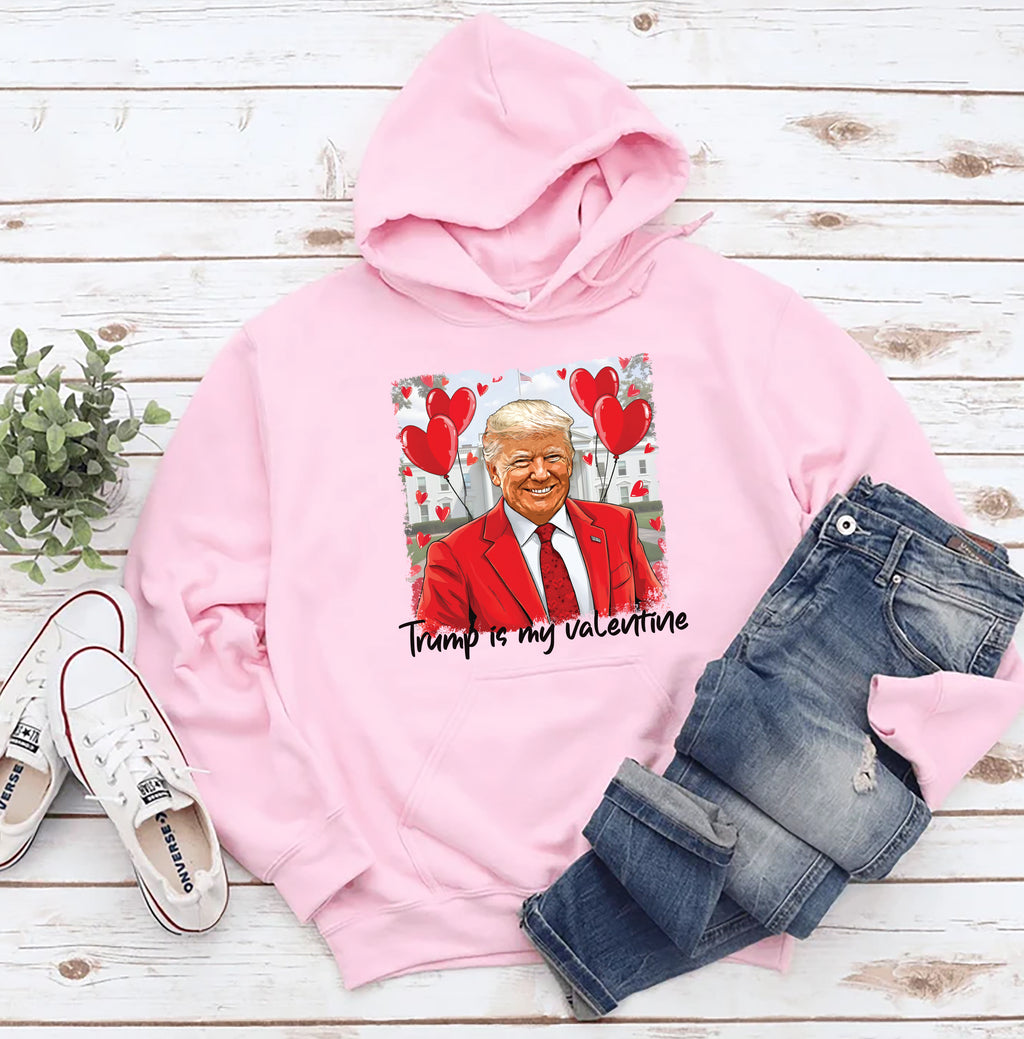a pink hoodie with a picture of a man wearing a red suit