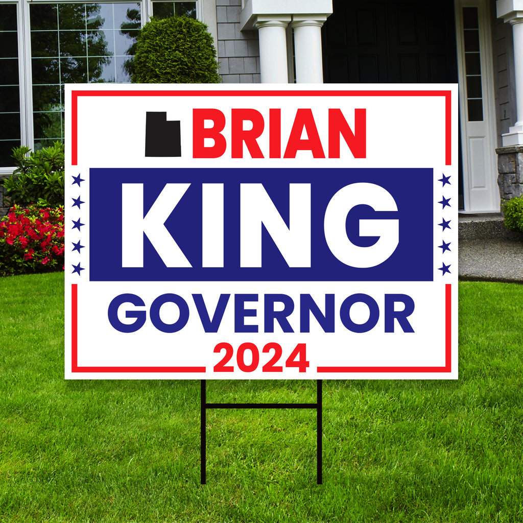 a political yard sign in front of a house