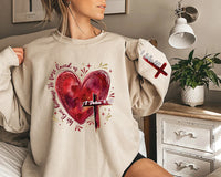 Heart Cross Valentine Jesus Sweatshirt, We Love Because He First Loved Us Tee, Valentine Bible Verse Sweatshirt, Front Sleeve