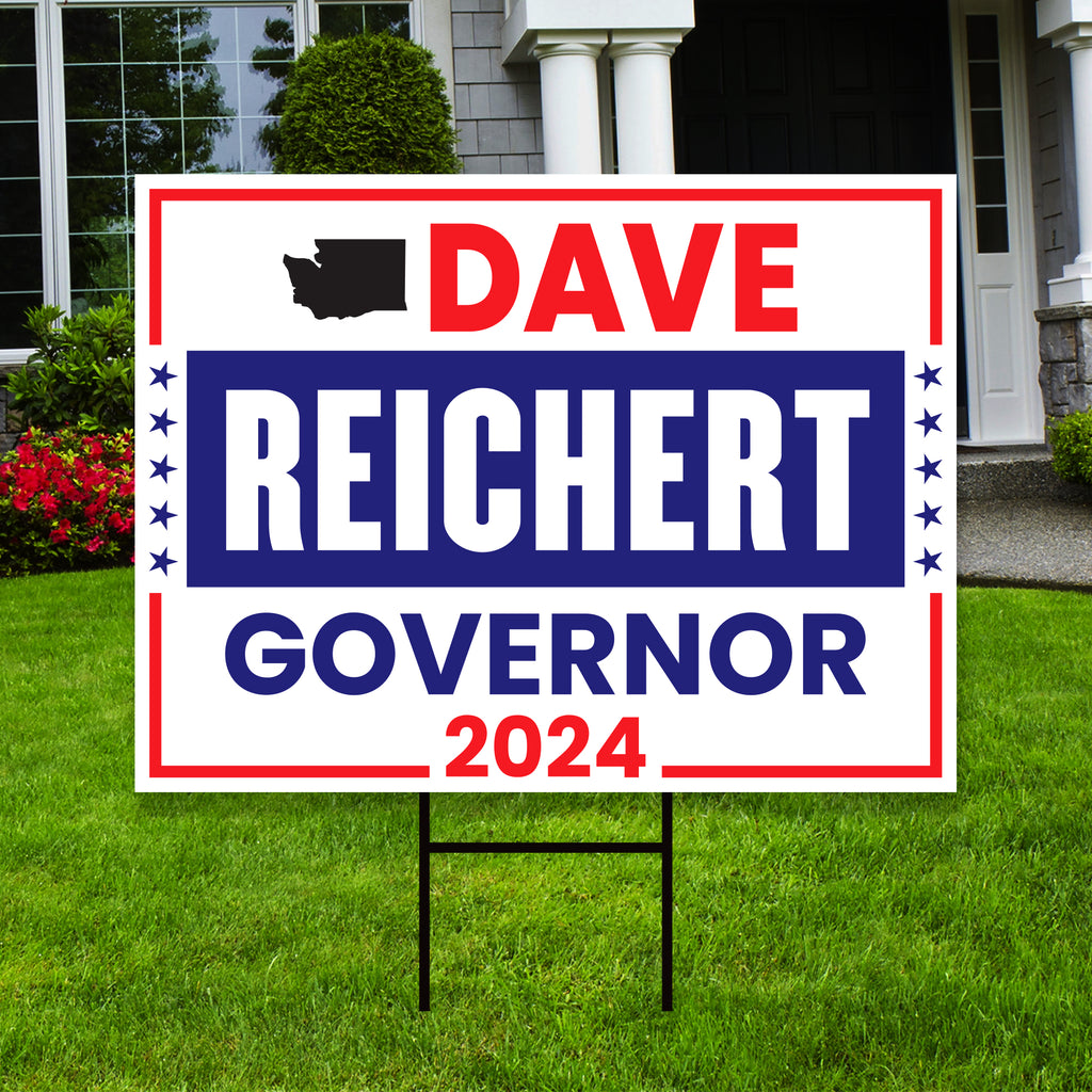 a political yard sign in front of a house