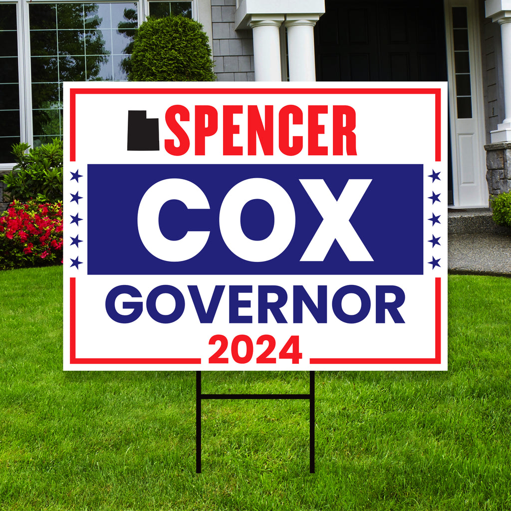 a political yard sign in front of a house