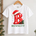 Personalized Christmas Initial Shirt, Custom Name Holiday Tee, Festive Santa Hat Letter Top, Family Matching Outfit, Holiday Gift for Kids