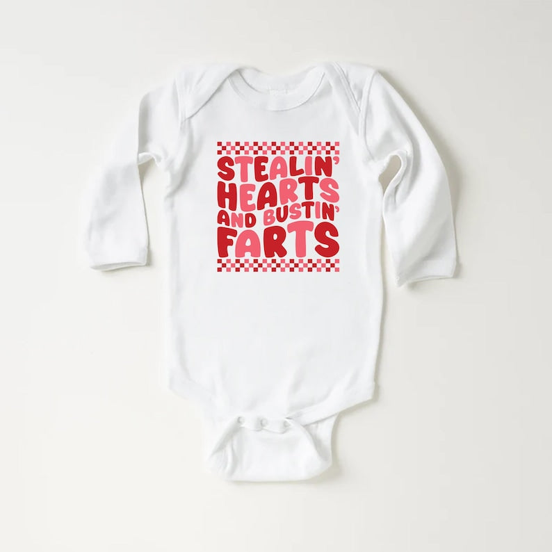 Stealin’ Hearts and Bustin’ Farts Baby Bodysuit