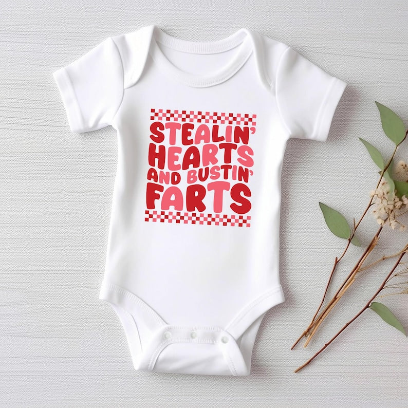 Stealin’ Hearts and Bustin’ Farts Baby Bodysuit