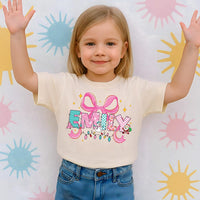 Personalized Coquette Christmas Shirt for Kids, Toddler Girl Name Alphabet Tee, Custom Holiday Shirt, Unisex Christmas Shirt, Cute Xmas Gift