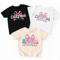 Personalized Coquette Christmas Shirt for Kids, Toddler Girl Name Alphabet Tee, Custom Holiday Shirt, Unisex Christmas Shirt, Cute Xmas Gift