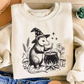 Vintage Woodcut Witch Possum Sweatshirt, Opossum Cauldron Graphic Shirt, Spooky Cottagecore Animal Top, Halloween Party Tee, Halloween Gift