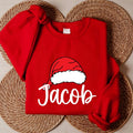 Personalized Family Christmas Shirt, Custom Santa Hat Name Sweatshirt, Matching Holiday Crew Tee, Xmas Pajama Top, Gift for Loved Ones