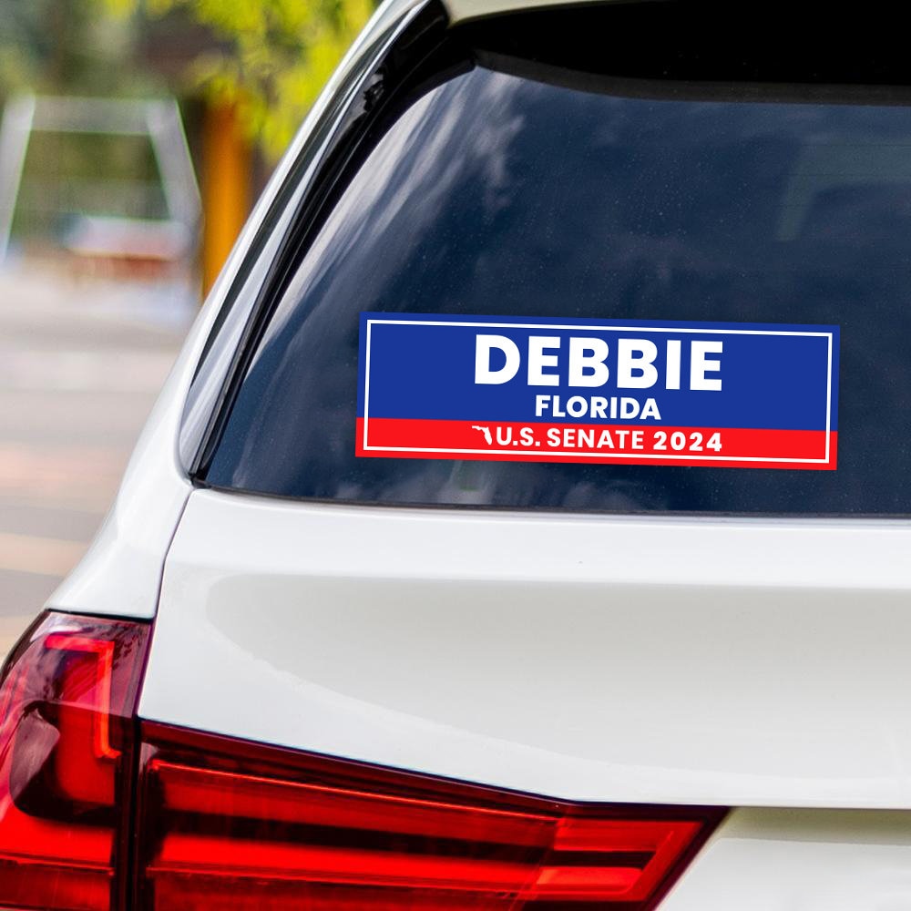 a blue and red decal on the back of a white car