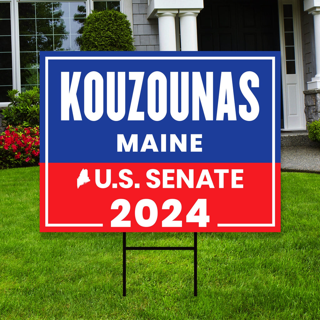 a political yard sign in front of a house