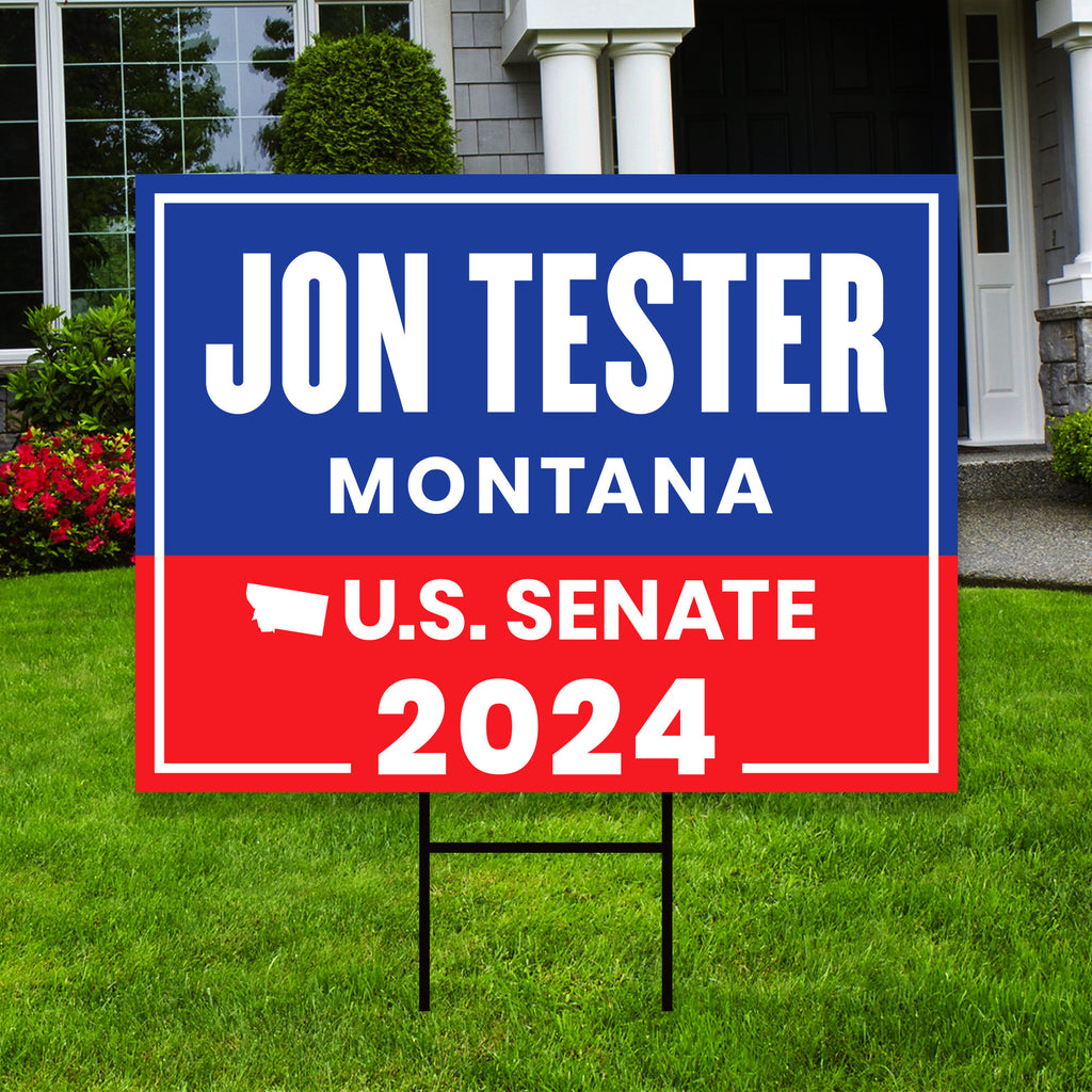 a real estate for sale sign in front of a house