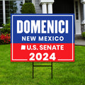 a red, white and blue political sign in front of a house