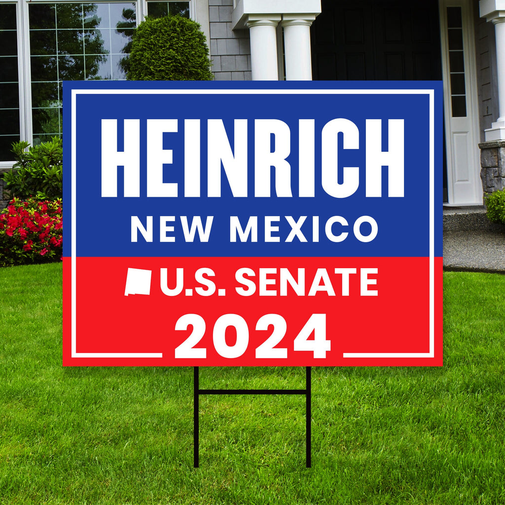 a real estate for sale sign in front of a house