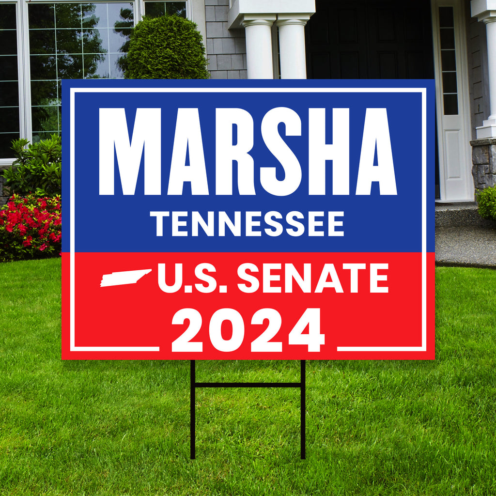 a real estate for sale sign in front of a house
