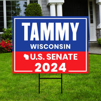 a political yard sign in front of a house
