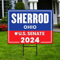 a red, white and blue sign in front of a house