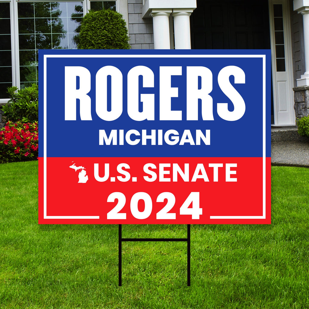 a real estate for sale sign in front of a house