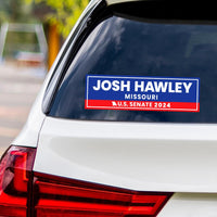 a sticker on the back of a white car