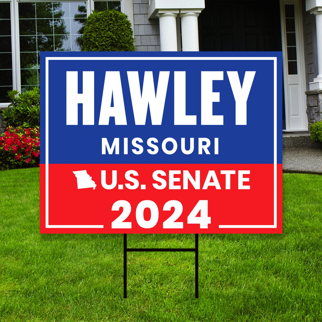 a political yard sign in front of a house