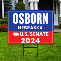 a real estate for sale sign in front of a house